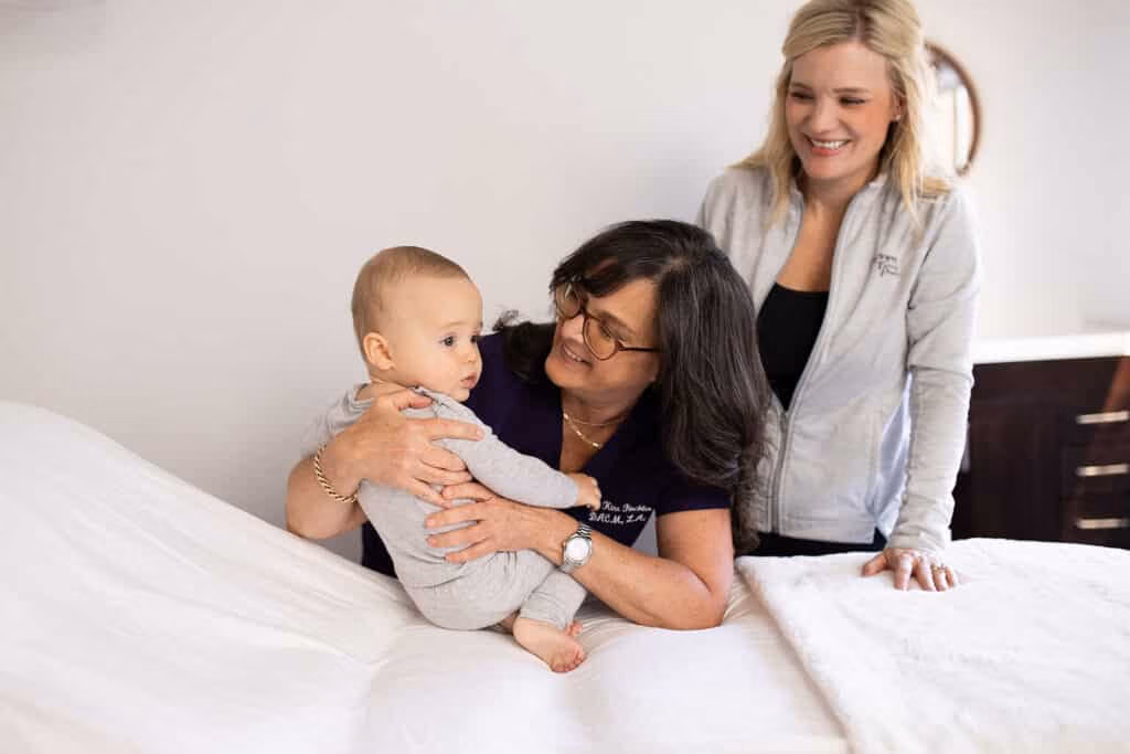 Dr. Kiné Fischler performing fertility acupuncture treatment at Willow Tree Acupuncture clinic in Portland Oregon